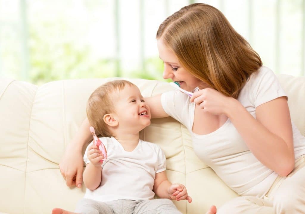 At what age should baby's teeth be brushed